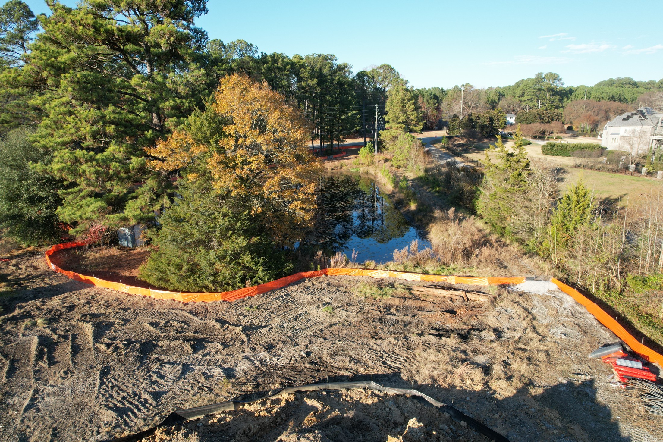 Earthwork aerial view showing grading, berms, and site boundaries